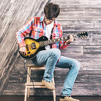 With this creative high school fundraiser, students can sing original songs at an open mic night.